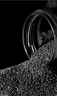 Small granules pouring from container